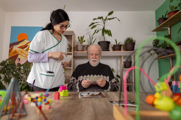 istock Senior man with dementia and photo therapy 1487468143