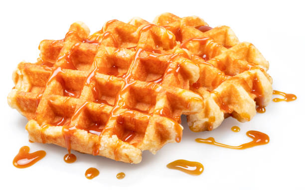 istock Belgian waffle with caramel topping isolated on white background. 1487469739