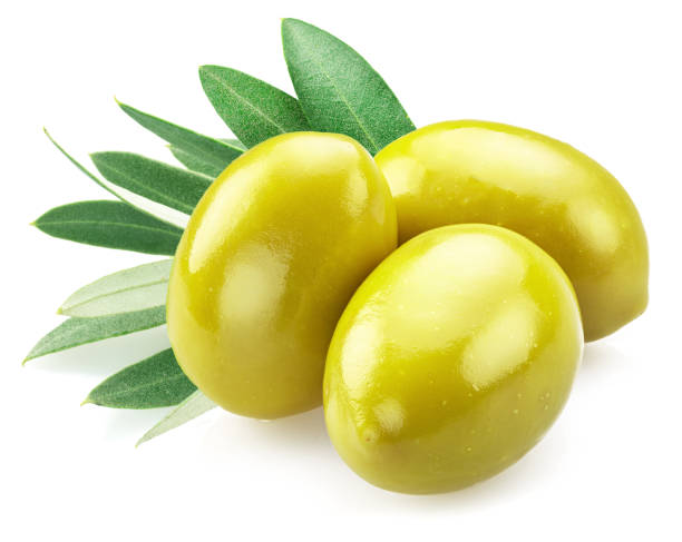 istock Three whole green olives with olive leaves isolated on white background. 1487469905