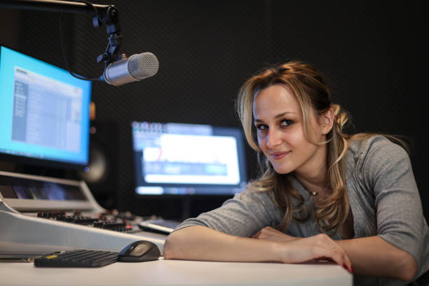 istock Young woman working as a presenter at a radio station 1487470854