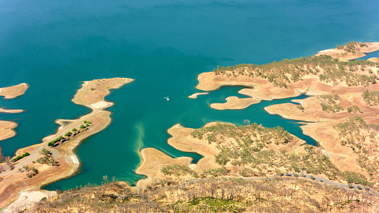 Aerial view of shore of lake Berryessa during sunny day, Napa County, California, USA.