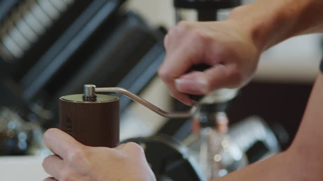 Closeup of barista hand dripping coffee serving customer