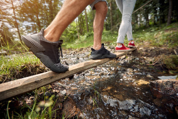 istock Close up  legs  goes for on the river. 1487475309