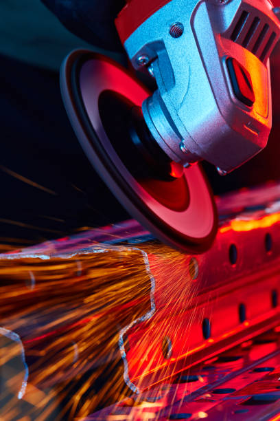 Worker Cutting Steel With Grinder