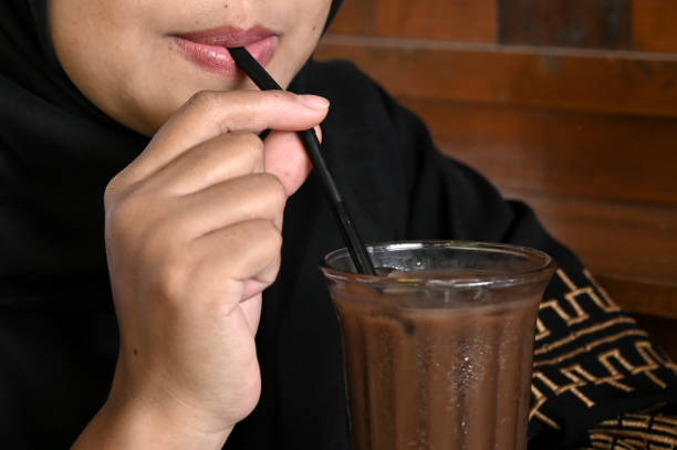 istock Close up Asian woman drinking chocolate 1487477192