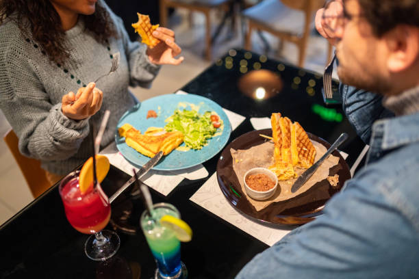 istock Couple having lunch in a restaurant 1487478732