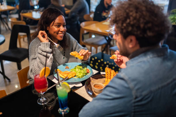istock Young couple eating in a restaurant 1487478888