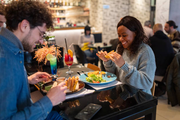 istock Young couple eating in a restaurant 1487479015