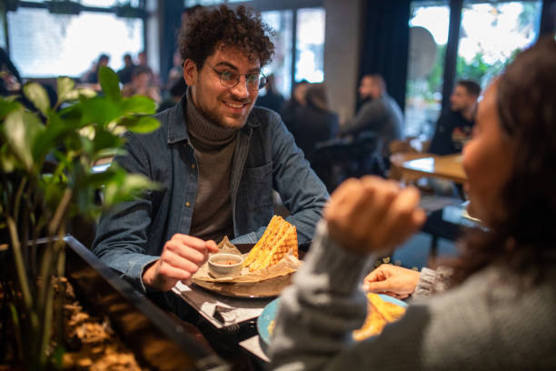 istock Couple talking in a restaurant before eating 1487479129