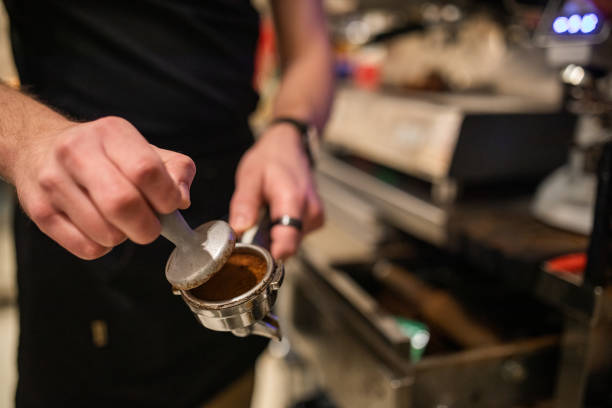 istock Barista making an espresso with an espresso machine 1487480048