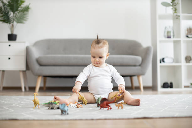 istock Infant child staying calm and happy while playing at home 1487480638