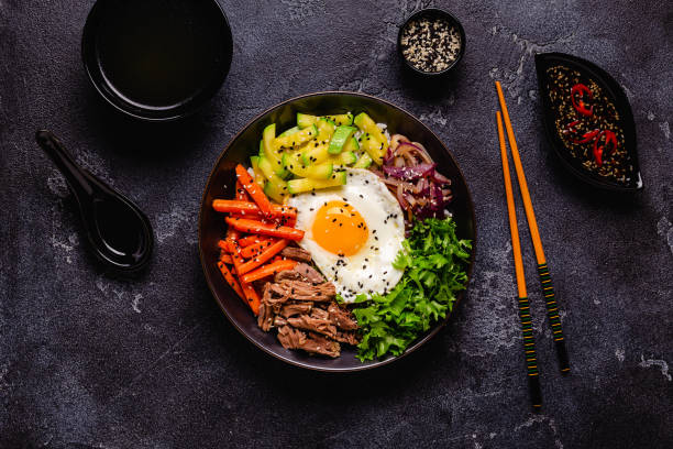 istock Traditional Korean dish Bibimbap: rice with vegetables beef and egg. 1487480829
