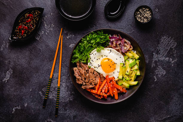 istock Traditional Korean dish Bibimbap: rice with vegetables beef and egg. 1487480852