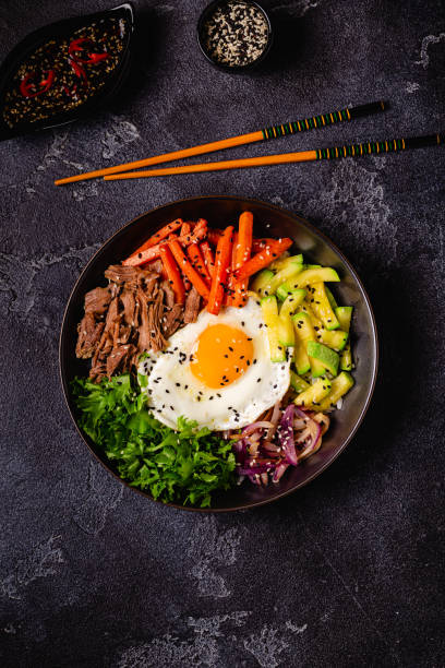 istock Traditional Korean dish Bibimbap: rice with vegetables beef and egg. 1487480957