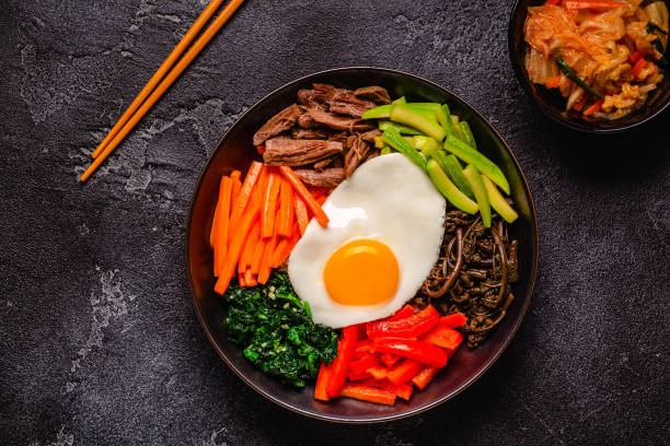 istock Traditional Korean dish Bibimbap: rice with vegetables beef and egg. 1487480965