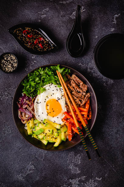 istock Traditional Korean dish Bibimbap: rice with vegetables beef and egg. 1487481040