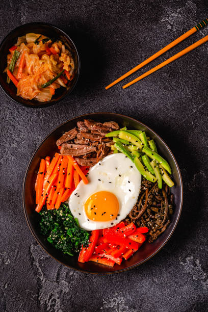 istock Traditional Korean dish Bibimbap: rice with vegetables beef and egg. 1487481214