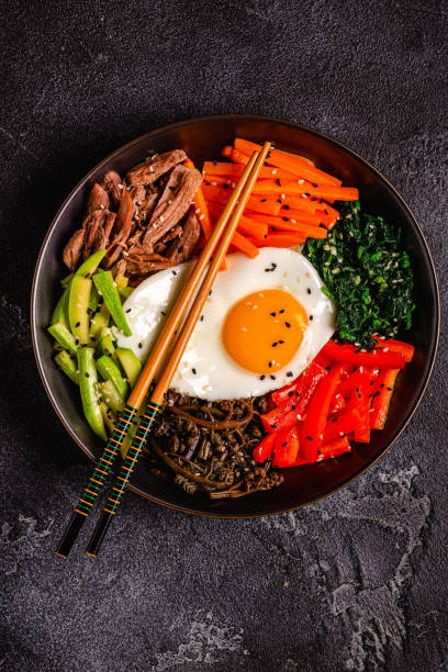 istock Traditional Korean dish Bibimbap: rice with vegetables beef and egg. 1487481215