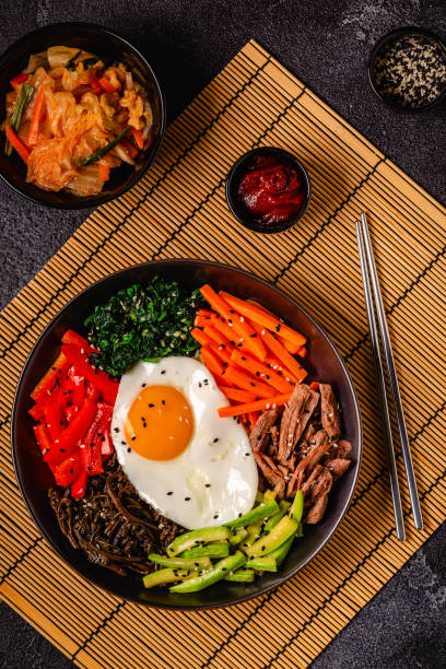 istock Traditional Korean dish Bibimbap: rice with vegetables beef and egg. 1487481218