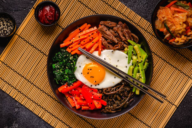 istock Traditional Korean dish Bibimbap: rice with vegetables beef and egg. 1487481235