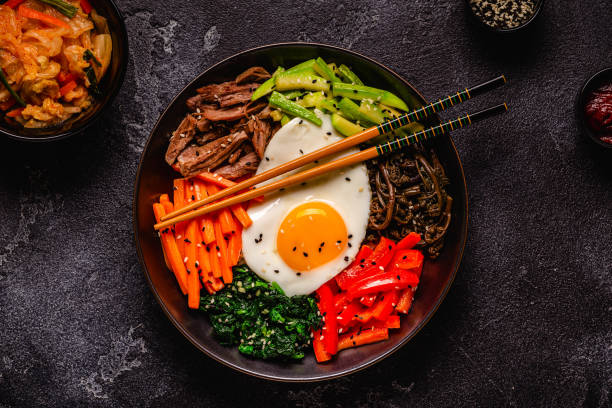 istock Traditional Korean dish Bibimbap: rice with vegetables beef and egg. 1487481424
