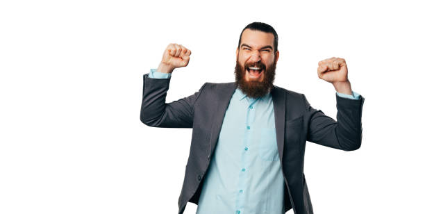 istock Cheerful strong bearded man is making the winner gesture near copy space. 1487482589