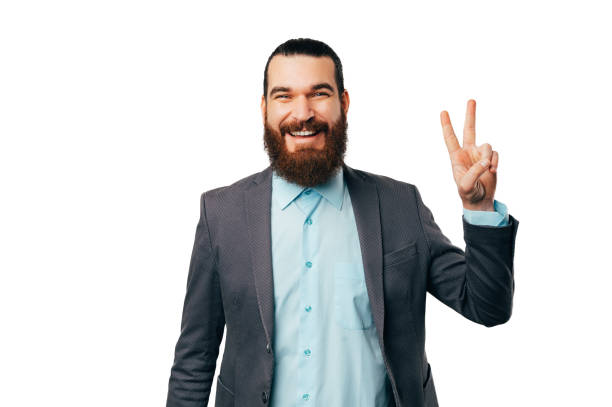 istock Handsome bearded man wearing jacket is showing the victory or peace gesture. 1487482604