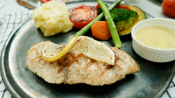 istock Salmon steak served with Mashed Potato and vegetable 1487485546