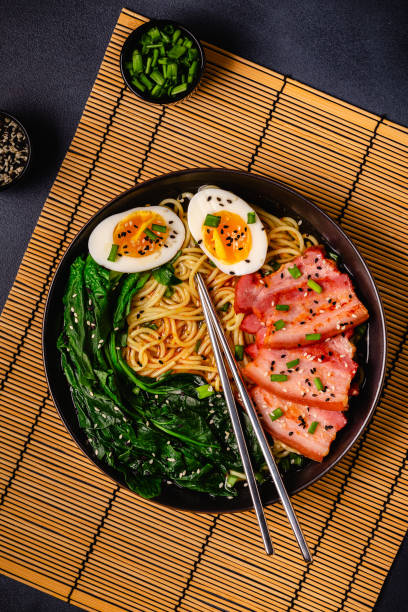 istock Traditional ramen noodle soup with brisket, spinach and egg. 1487486432