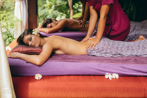 istock Couple at spa center having back massage 1487490682