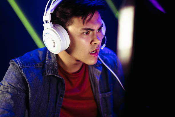 istock Shocked gamer looking at the computer screen during an online gaming session 1487491869