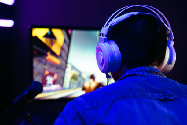 istock Computer gamer live streaming his video gameplay on an online platform 1487491992