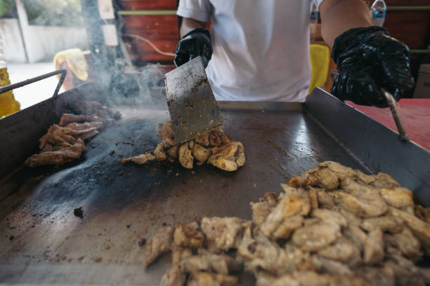 Grilling chicken skin on an iron plate