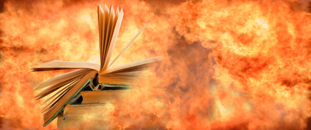 istock A stack of books and an open book on top are on fire and around the books everything is on fire. 1487492548