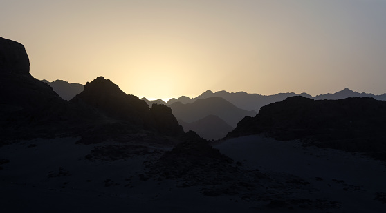 peaks of mountains in the desert of egypt against sunset landscape