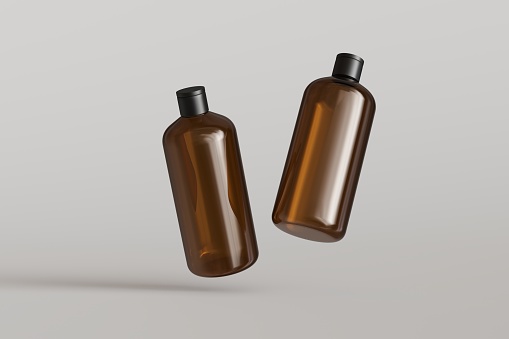 Two brown plastic cosmetic containers, shampoo bottles floating on gray background front view 3D render mockup, commercial branding desing-ready template