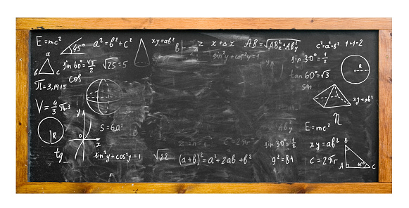 An image of a school board on which mathematical formulas and expressions are written, there are no formulas on the middle part of the board. because they were wiped out