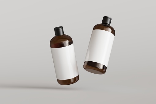 Two brown plastic cosmetic containers with labels, shampoo bottles floating on gray background front view 3D render mockup, commercial branding desing-ready template