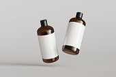 Two brown plastic cosmetic containers with labels, shampoo bottles floating on gray background front view 3D render mockup