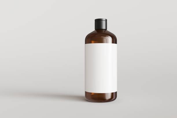 Brown plastic hampoo bottle with label on gray background front view 3D render mockup stock photo