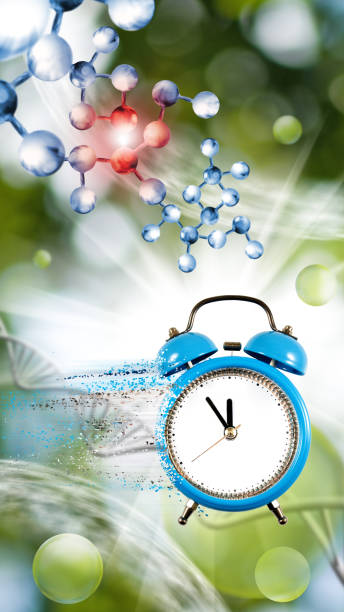 istock image of a collapsing clock, from which particles are torn off against the background of stylized DNA chains, part of the chain is highlighted in red as painful 1487496764