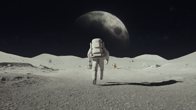 Following Shot of Brave Astronaut in Space Suit Confidently Walking on the Surface of Space Planet , Covered in Rocks. First Astronaut On  Space Planet. Moon rover and Base Station. Advanced Technologies, Space Exploration/ Travel, Colonization Concept.