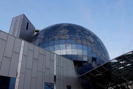 Bottom view of the exposition building Planet Ocean, a new mirror building-ball of the Museum of the World Ocean in Kaliningrad with clouds reflected.