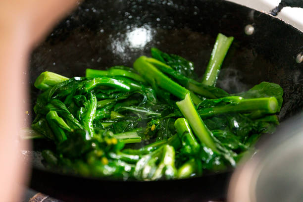 istock Stir-fried vegetables in the Chinese family kitchen 1487500034