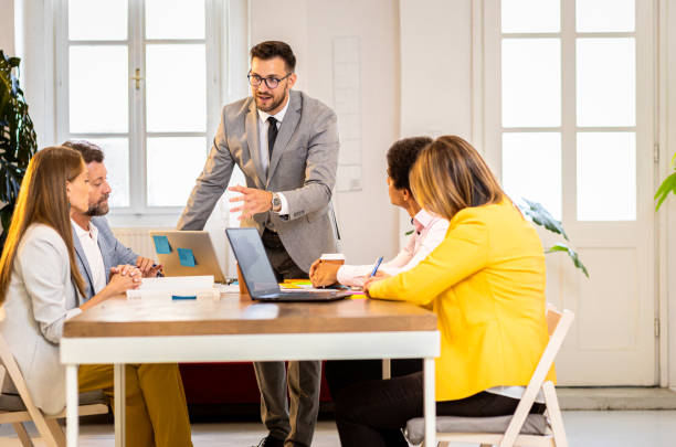 istock Group of business people working in office. 1487500114