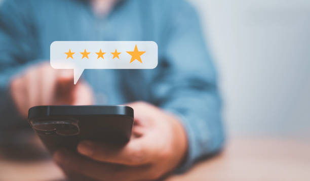 istock Businessman using smartphone for giving golden five stars for excellent evaluate after customer use product service , ISO and quality standard certificate concept. 1487503173