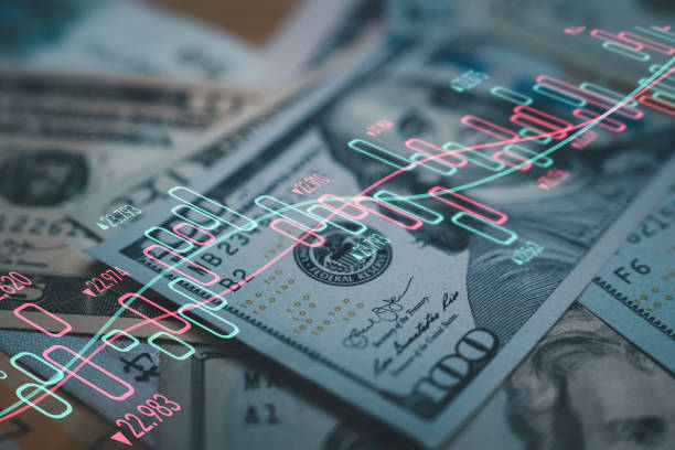 Closeup Benjamin Franklin face on USD banknote with stock market chart graph for currency exchange and global trade forex concept.
