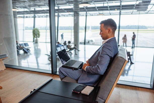 istock Business Class Lounge: Japanese Executive at Work 1487505908