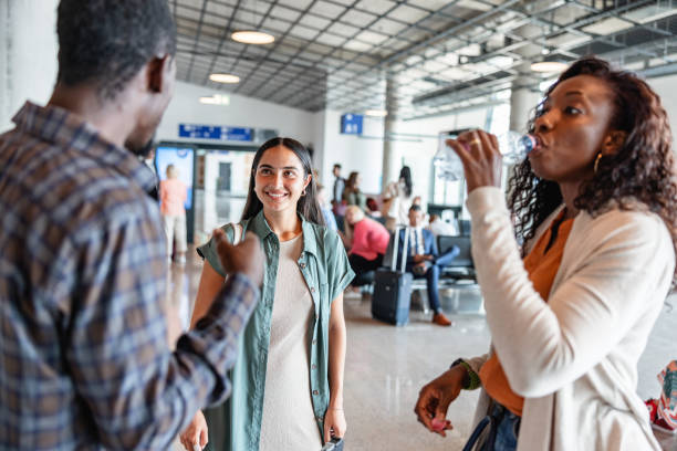istock Multi Ethnic Group Of Friends Waiting At The Gate Before The Flight 1487505937