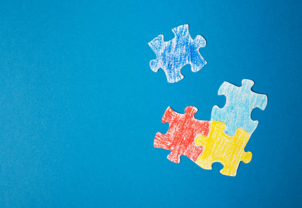 istock Colorful puzzle on blue background. Copy space 1487506143
